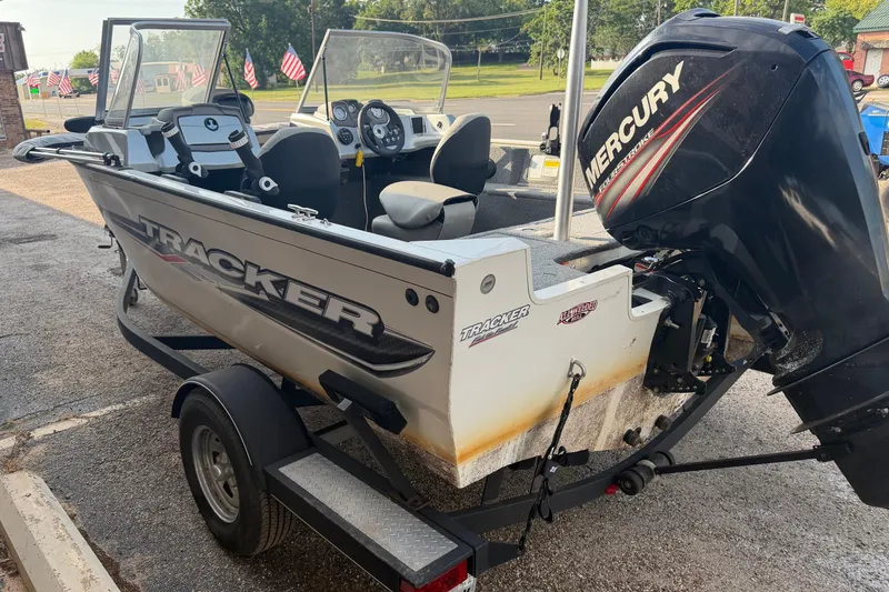 Slide: The Image of 2018 Tracker Pro Guide V-165 WT boat with Mercury outboard motor on trailer. - 6