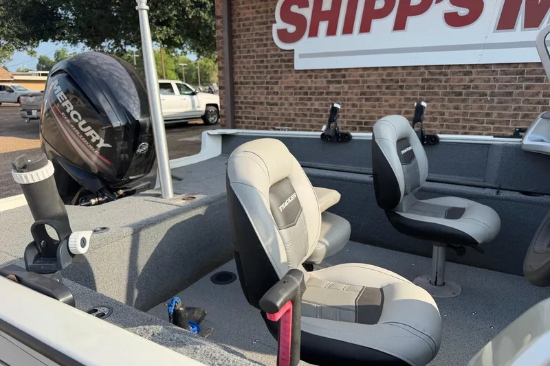 Slide: The Image of 2018 Tracker Pro Guide V-165 WT boat interior with Mercury engine and seating. - 4