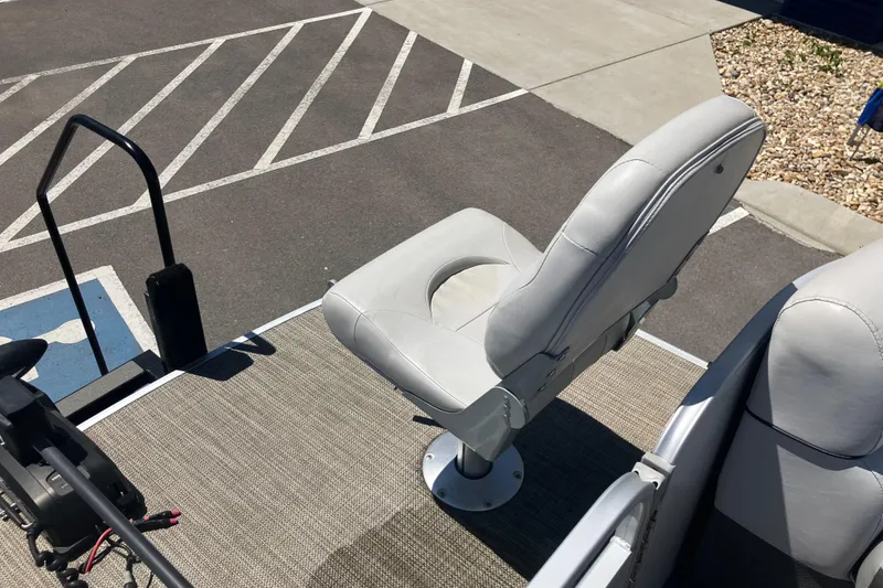Slide: The Image of 2023 Godfrey Sweetwater 2286 BF boat seat on deck, near parking area. - 13