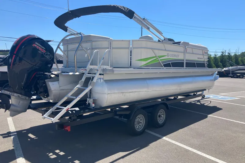 Slide: The Image of 2023 Godfrey Sweetwater 2286 BF pontoon boat on trailer in parking lot. - 3