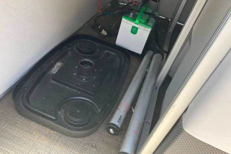 Slide: The Image of 2023 Godfrey Sweetwater 2286 BF boat interior with battery and equipment storage. - 6