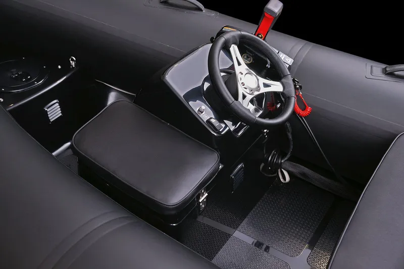 Slide: The Image of Manufacturer Provided Image: Interior of Brig Falcon Tender 360, 2026 model, featuring steering wheel and seat. - 3