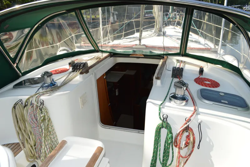 Slide: The Image of Cockpit of a 1999 Beneteau 411 sailboat with ropes and winches. - 12