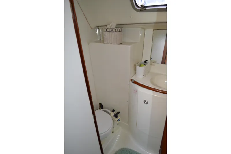 Slide: The Image of Bathroom interior of 1999 Beneteau 411 yacht, featuring compact design and modern amenities. - 39