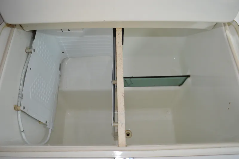 Slide: The Image of Interior view of a 1999 Beneteau 411 yacht compartment with storage space. - 31