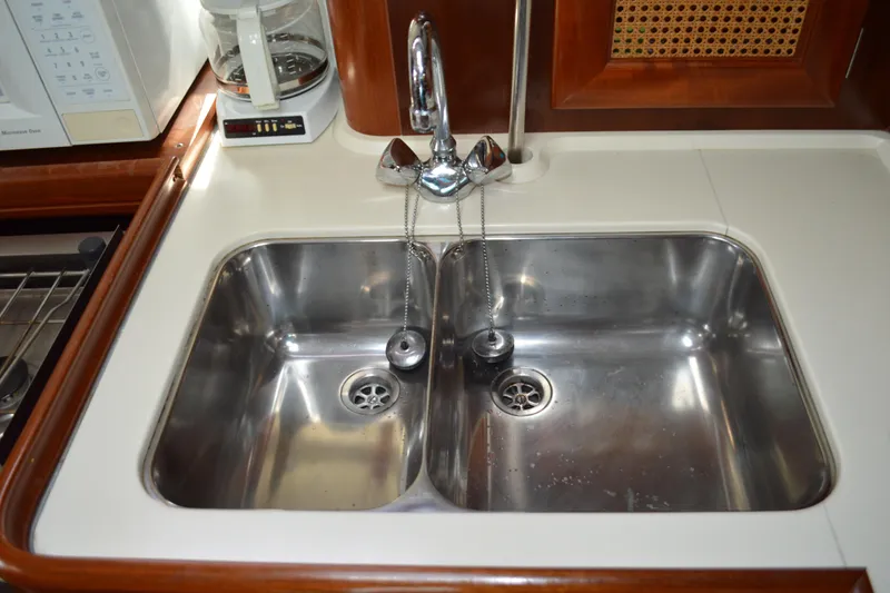 Slide: The Image of Stainless steel sink in 1999 Beneteau 411 yacht kitchen with faucet and coffee maker. - 29