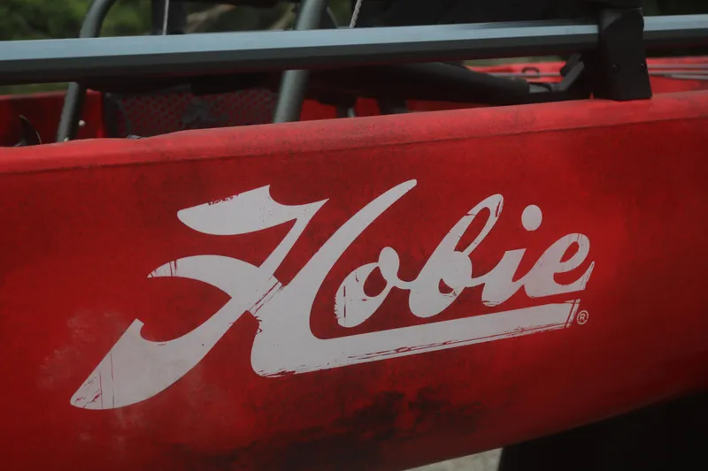 Slide: The Image of Red Hobie Mirage Pro Angler 14 kayak, 2023 model, featuring bold white logo. - 4