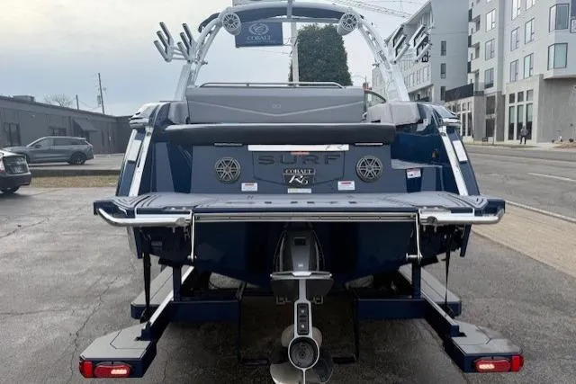 Slide: The Image of 2026 Cobalt R6 Surf boat rear view, parked on urban street. - 6