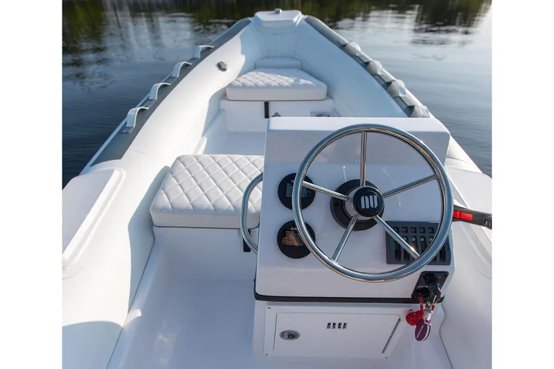 Slide: The Image of Manufacturer Provided Image: Novurania DL 430 boat 2026, interior view with steering console. - 2