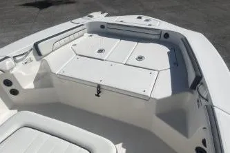 Slide: The Image of 2016 Yamaha Boats 190 FSH Sport interior, featuring spacious seating and storage compartments. - 8