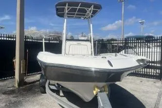 Slide: The Image of 2016 Yamaha Boats 190 FSH Sport on trailer, parked outdoors under clear sky. - 3