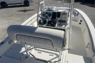 Slide: The Image of 2016 Yamaha Boats 190 FSH Sport interior, featuring helm and seating area. - 7