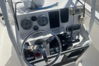 Slide: The Image of 2016 Yamaha Boats 190 FSH Sport dashboard with steering wheel and controls. - 11