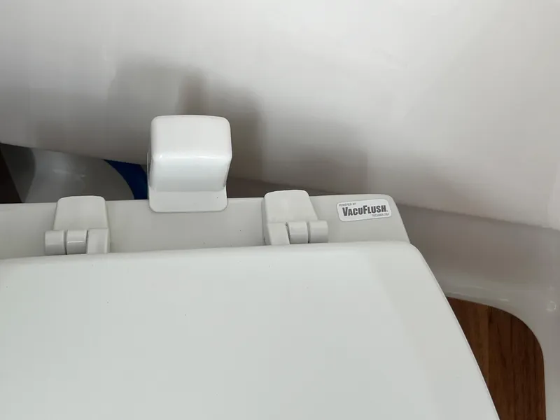 Slide: The Image of A white boat toilet with a VacuFlush system. - 37