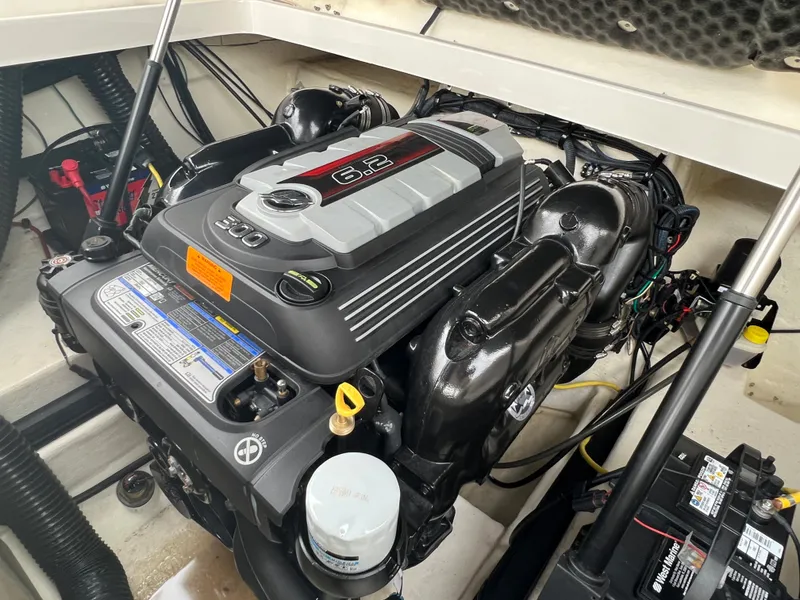 Slide: The Image of Engine compartment of a 2016 Chaparral 257 SSX featuring a powerful engine. - 29