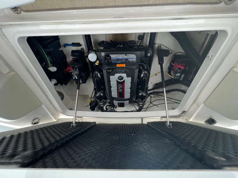 Slide: The Image of Engine compartment of a 2016 Chaparral 257 SSX with a clean engine and organized wiring. - 50