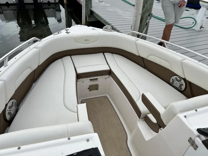 Slide: The Image of The image shows the bow area of a 2016 Chaparral 257 SSX boat with white and brown seating. - 17
