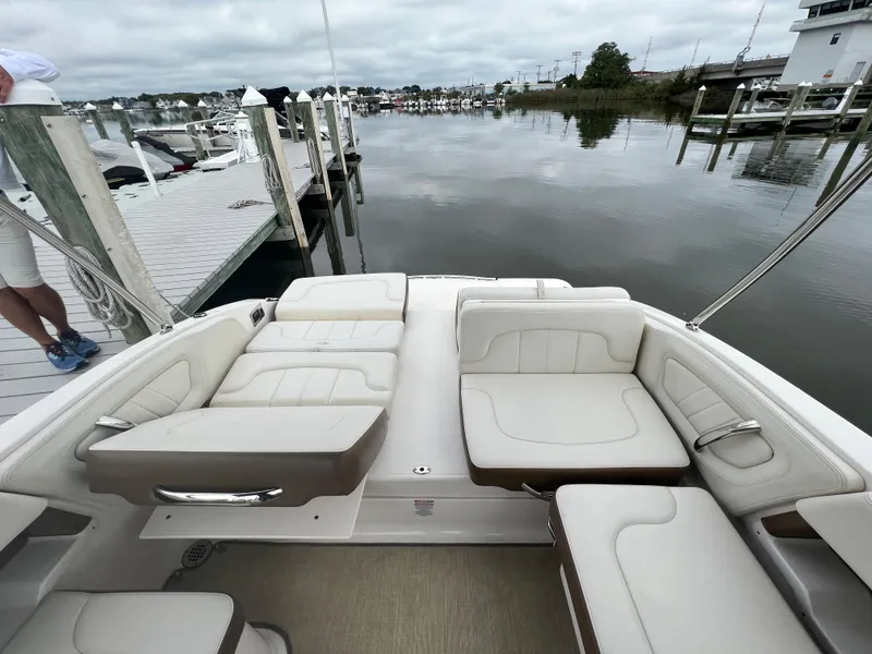 Slide: The Image of The image shows the cockpit of a 2016 Chaparral 257 SSX boat with beige upholstery. - 27