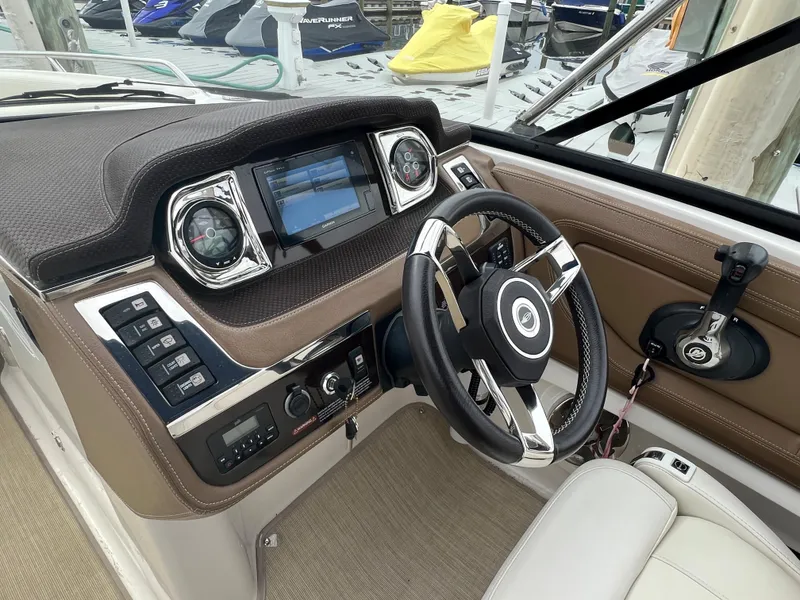 Slide: The Image of The image shows the cockpit of a 2016 Chaparral 257 SSX with a modern helm. - 42