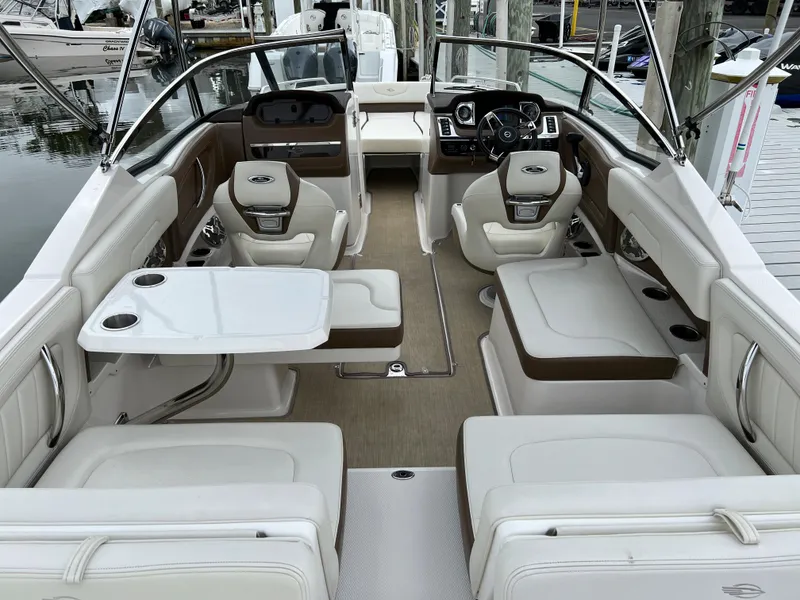 Slide: The Image of Interior view of a Chaparral 257 SSX boat with white and brown seating. - 49