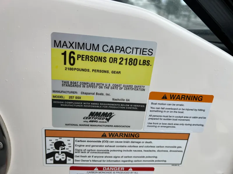Slide: The Image of Safety label on a boat with capacity and warning information. - 19