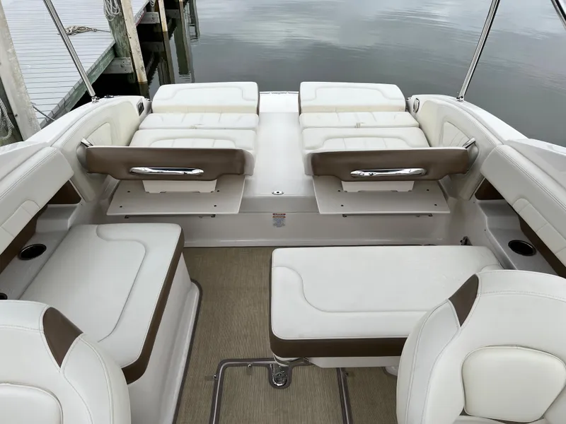 Slide: The Image of The image shows the cockpit of a 2016 Chaparral 257 SSX with white and brown seating. - 23