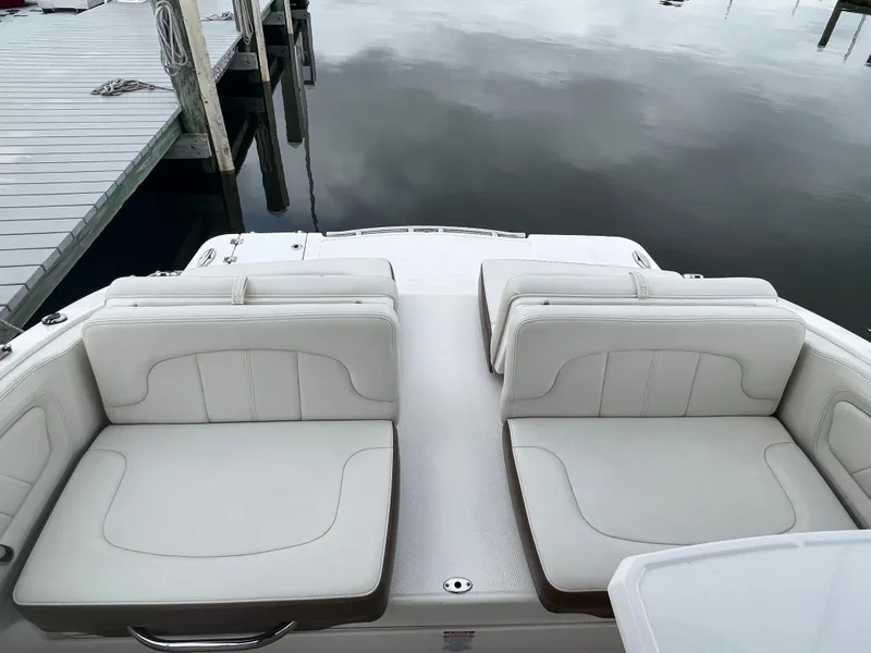 Slide: The Image of The image shows the cockpit of a 2016 Chaparral 257 SSX with white upholstered seats. - 28