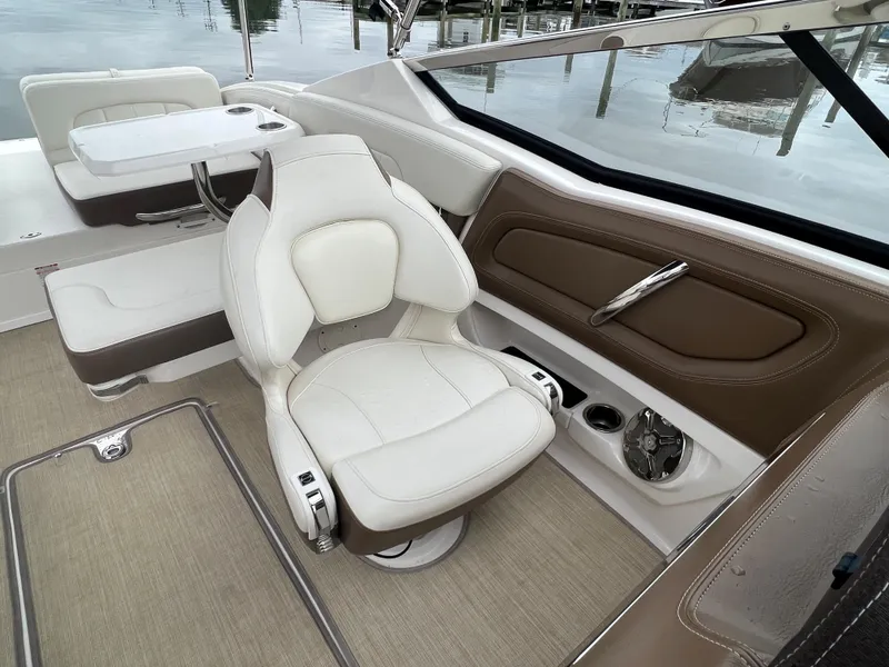 Slide: The Image of Interior of a 2016 Chaparral 257 SSX with beige and brown upholstery. - 39