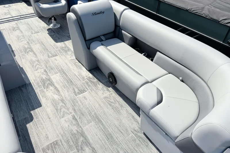 Slide: The Image of Luxurious seating on 2027 Bentley Pontoons Legacy 240 Navigator with elegant flooring. - 6