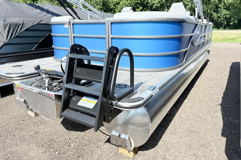 Slide: The Image of 2027 Bentley Pontoons Legacy 240 Navigator, blue exterior, docked on a sunny day. - 3