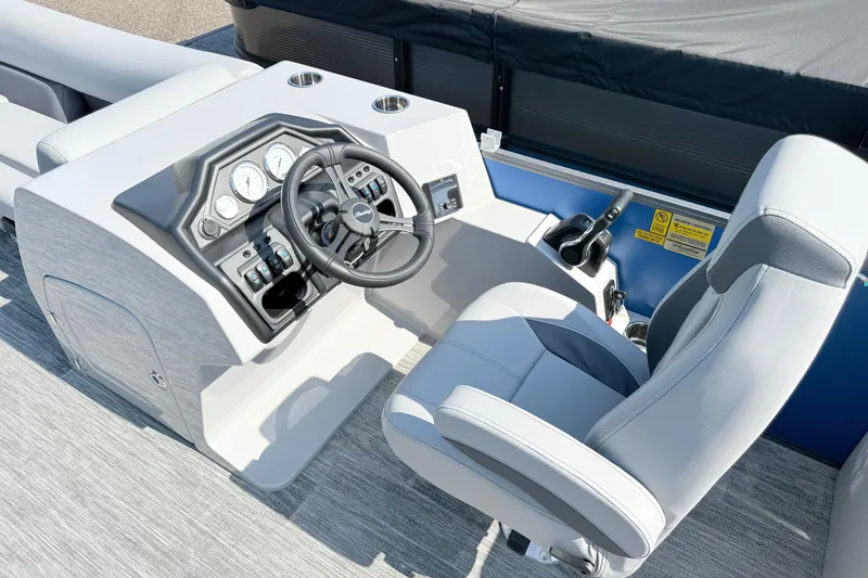 Slide: The Image of 2027 Bentley Pontoons Legacy 240 Navigator helm with modern controls and comfortable captain's chair. - 5