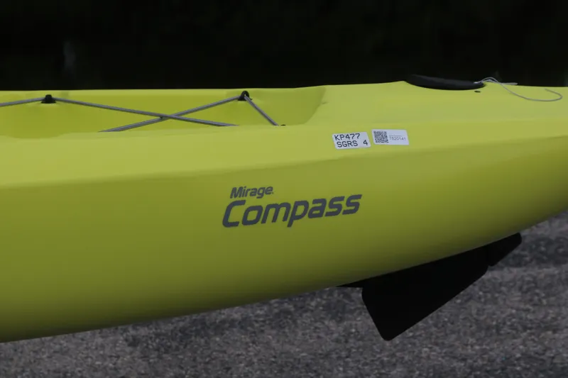Slide: The Image of 2025 Hobie Mirage Compass kayak in vibrant yellow, featuring sleek design and branding. - 2
