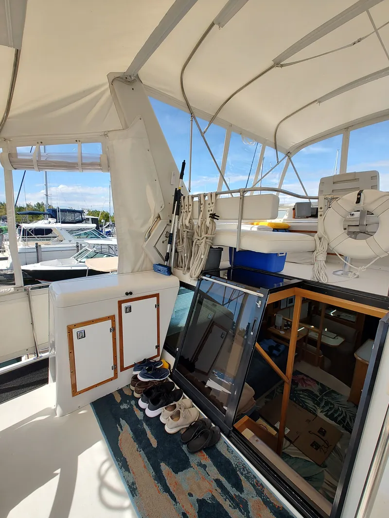 Slide: The Image of The image shows the deck of a 1989 Chris-Craft Catalina with several shoes and a ladder. - 4