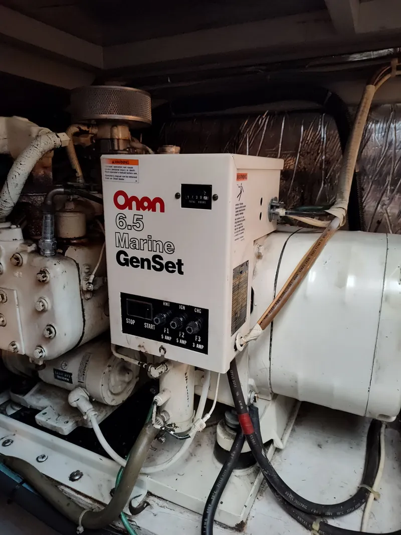Slide: The Image of An Onan 6.5 marine generator is installed in a boat engine room. - 26
