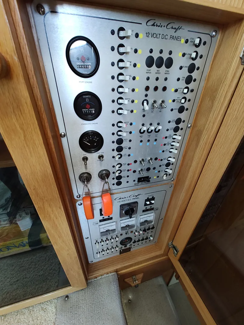 Slide: The Image of Electrical control panel of a 1989 Chris-Craft Catalina with switches and gauges. - 12