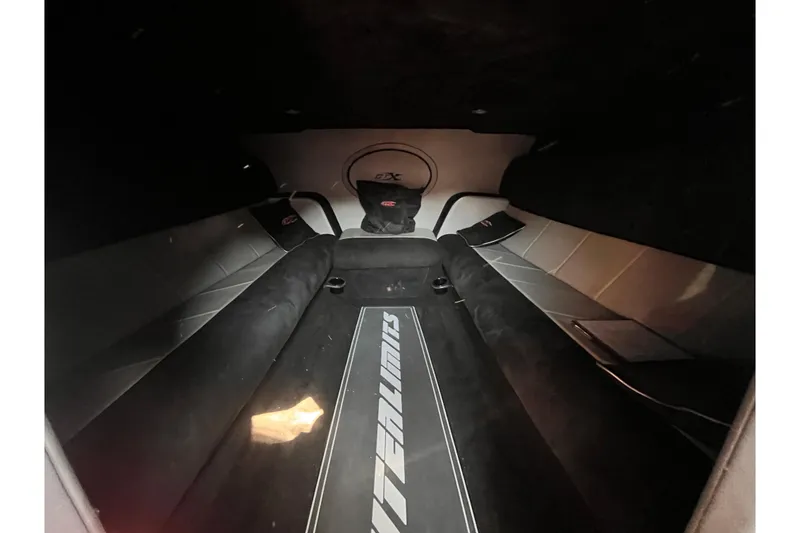 Slide: The Image of Interior of 2007 Outerlimits 39 GTX boat, featuring sleek seating and modern design. - 19