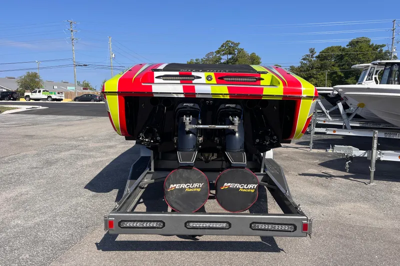 Slide: The Image of 2007 Outerlimits 39 GTX powerboat with vibrant red and yellow design, featuring Mercury Racing engines. - 4