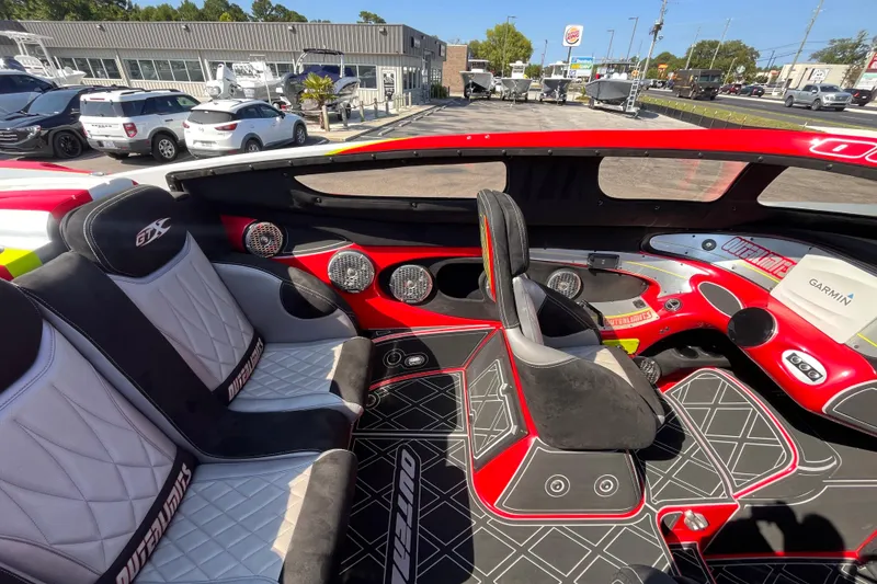 Slide: The Image of Interior of a 2007 Outerlimits 39 GTX boat with modern seating and dashboard. - 16