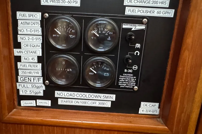 Slide: The Image of Control panel with gauges and labels for Mason 54, 1989 model, featuring fuel and oil specifications. - 29