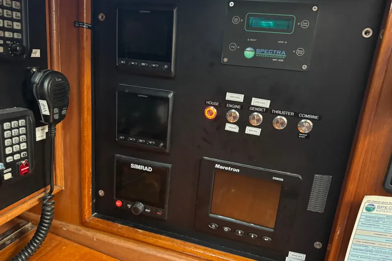 Slide: The Image of Control panel with navigation and communication equipment on a 1989 Mason 54 yacht. - 26