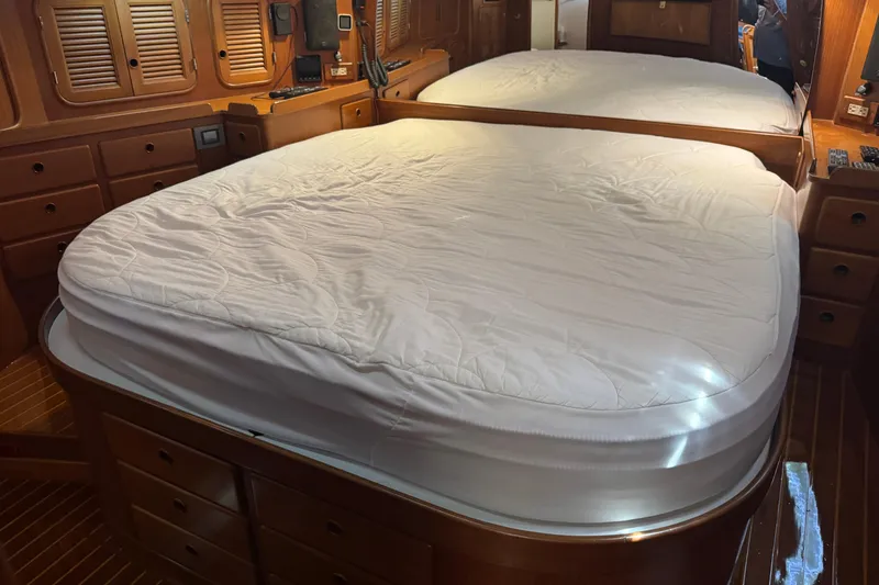 Slide: The Image of Luxurious cabin interior with a large bed in a 1989 Mason 54 yacht. - 3