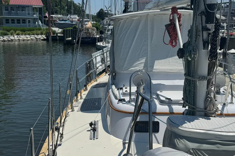 Slide: The Image of Sailboat docked at marina, Mason 54 model, 1989, with rigging and covered deck. - 51