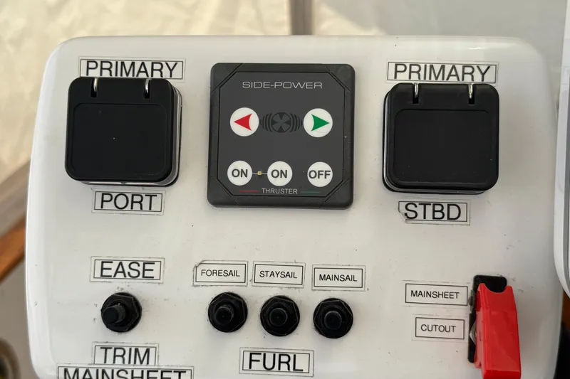 Slide: The Image of Control panel of a 1989 Mason 54 sailboat with various switches and labels. - 41