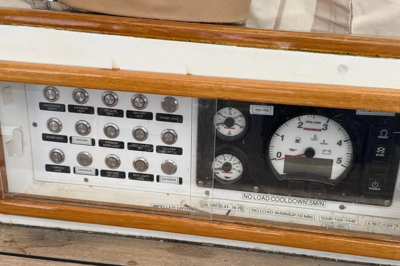Slide: The Image of Control panel of a 1989 Mason 54 yacht with gauges and switches. - 43