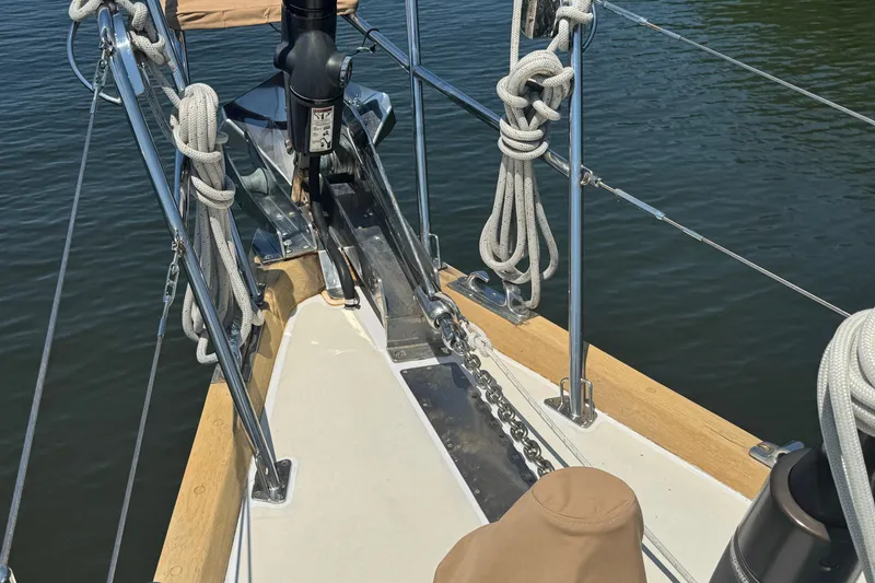 Slide: The Image of Bow of 1989 Mason 54 sailboat with ropes and anchor chain on deck. - 45