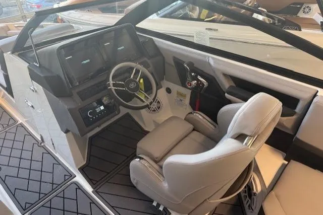 Slide: The Image of Interior of 2026 Cobalt R4 boat featuring modern helm and comfortable seating. - 7