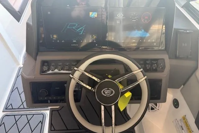 Slide: The Image of Steering wheel and dashboard of 2026 Cobalt R4 boat with digital displays. - 12