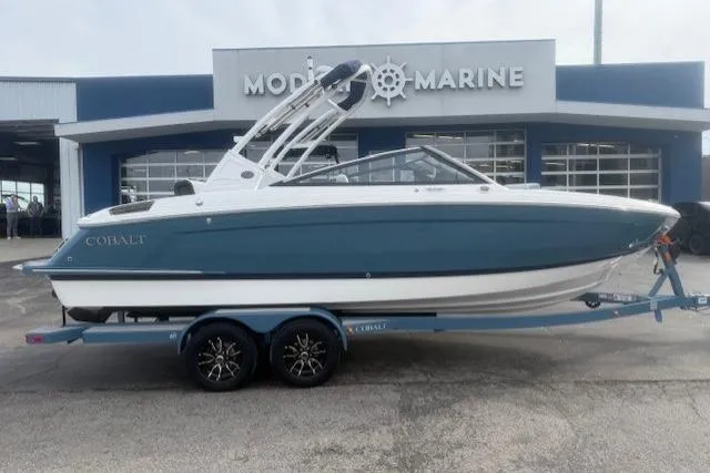 Slide: The Image of 2026 Cobalt R4 boat on trailer outside Modern Marine dealership. - 9