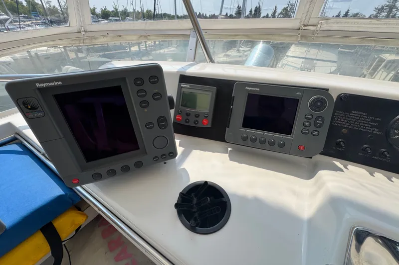Slide: The Image of Helm of 1989 Chris-Craft 372 Catalina with Raymarine navigation equipment. - 34