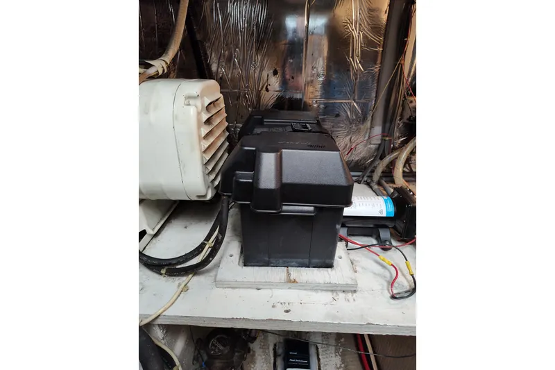 Slide: The Image of Engine compartment of 1989 Chris-Craft 372 Catalina with battery box and wiring. - 24